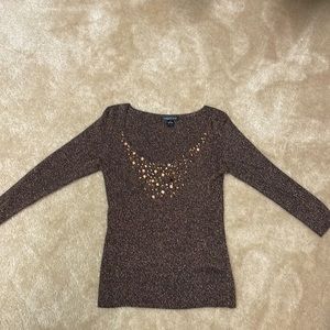 Small shimmery light weight sweater. Perfect for holiday parties.